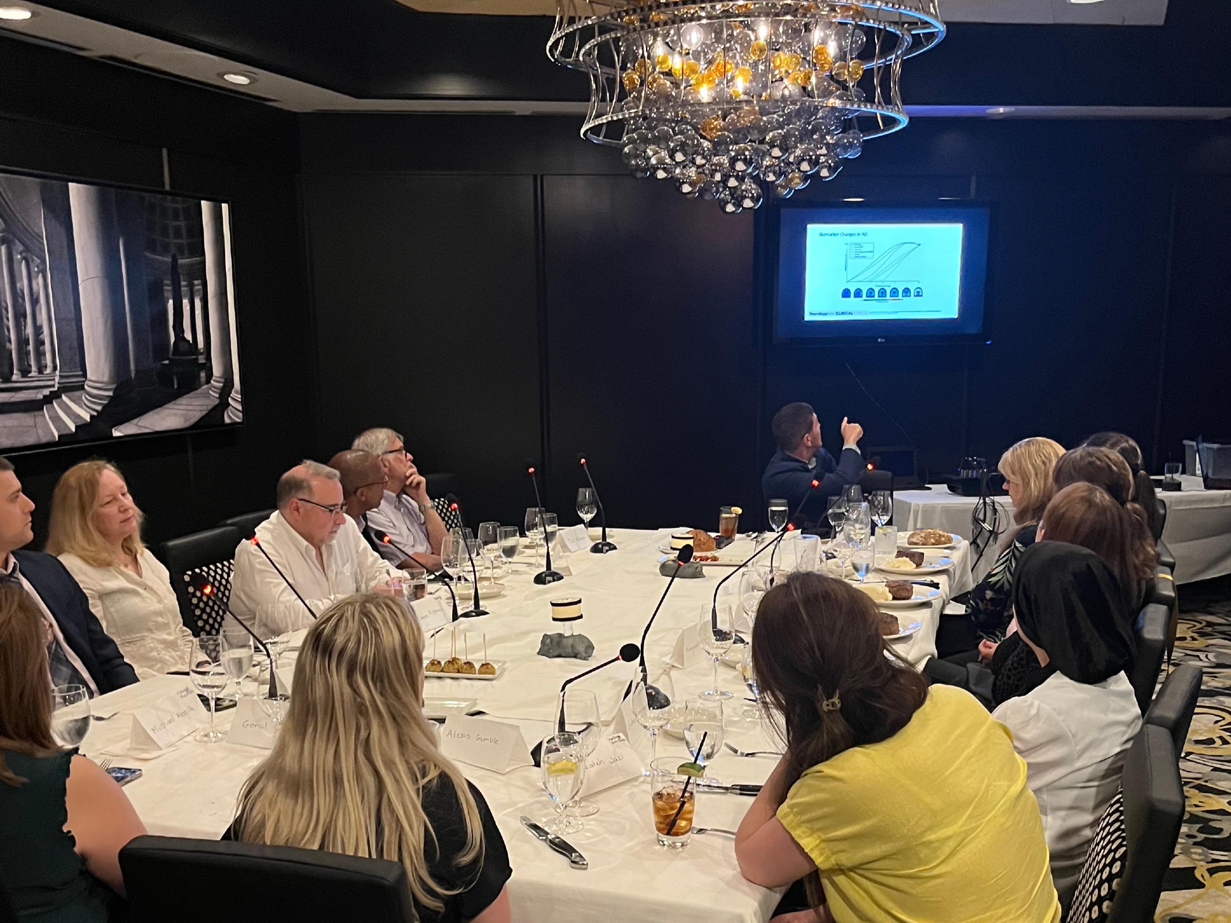 A private room arranged for a formal dinner and clinical discussion.
