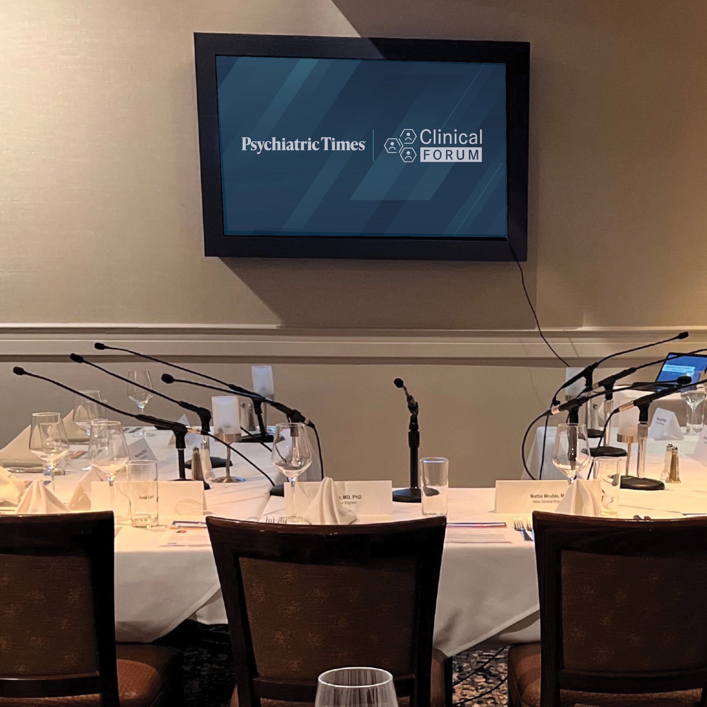 A presenter speaks to guests at a Psychiatric Times event.