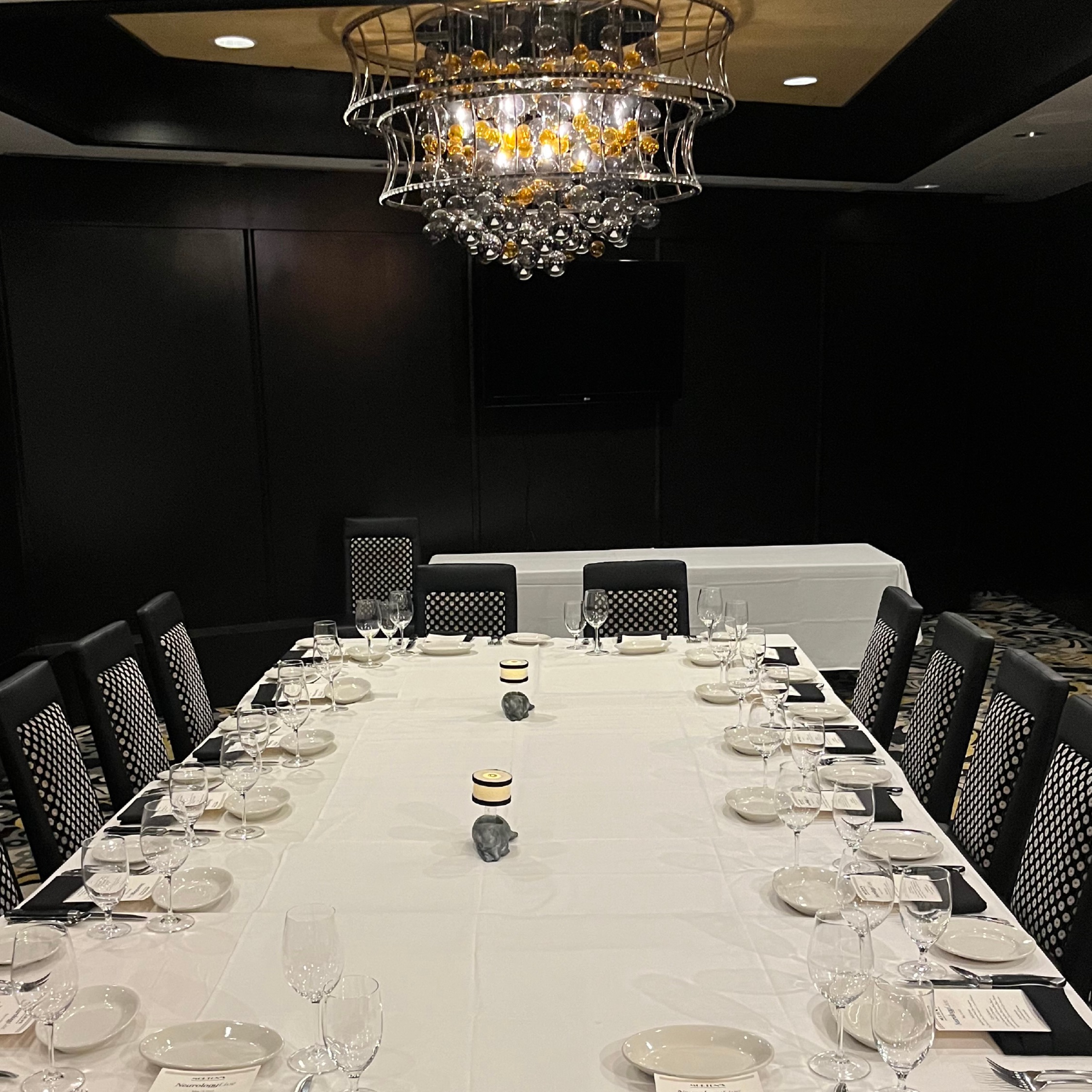 A group of mental health professionals seated around a table, engaged in collaborative discussion.